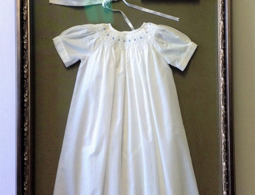 Christening hat and gown with picture floated on silk